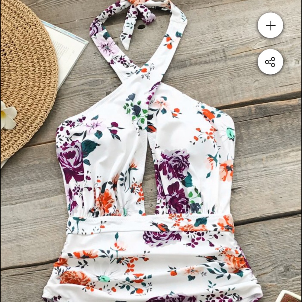 One piece white floral suit. New with tags